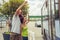 Young couple waving goodbye to their friends on the bus