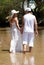 The young couple in white going on river