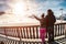 Young couple in winter vacation at snow resort mountain - Skiers tourists relaxing in ski slope chalet - Travel, holiday,