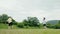 A young couple, a woman and a man, playing at badminton. Slow motion. Summer recreation concept