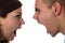 Young couple yells at each other isolated on white