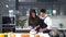 Young couples are helping to chop vegetables in the kitchen. Asian couple cooking together at the kitchen.