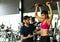 Young couples work out at the gym to strengthen the body
