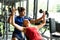 Young couples work out at the gym to strengthen the body