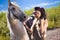 Young cowgirl with gun outdoor