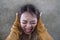 Young crazy desperate and upset Asian Korean woman screaming scared and anxious feeling anger and pain isolated on dark background