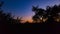 Young crescent moon on a clear sky at the end of the day in the summer