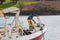 A young crew member on the bow of a trawler as she docks in Kinsale Harbor in County Cork on the south coast of Ireland.