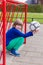 Young crouching girl with ball in red metal goal