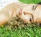 Young cute adorable real summer girl on green grass outside relaxing smiling, lifestyle people concept
