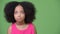 Young cute African girl with Afro hair looking bored