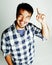 Young cute asian man on white background gesturing emotional, pointing, smiling, lifestyle people concept