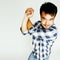 Young cute asian man on white background gesturing emotional, pointing, smiling, lifestyle people concept, cheerfull
