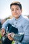 Young cute boy playing guitar