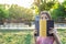 Young cute girl covers her face with a book. Surprised and shocked woman. Emotional girl holding a book in her hands