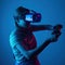 Young cute girl playing vr. with creative blue-red light. it is emeanantly and fun