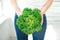 Young cute girl with salad. Cropped front view.