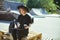 Young cute modern millennial hipster girl in hat dressed in black relax and work in Skatepark.