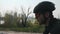 Young cyclist with beard wearing sunglasses, helmet and black outfit riding a bicycle. Close up side view. Cycling concept. Slow m