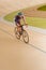 young cyclist in helmet training on cycle