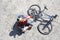 Young cyclist rest near bike