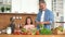 Young dad teaching child learning preparing healthy food cutting vegetable salad