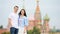 Young dating couple in love walking in city background St Basils Church