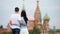 Young dating couple in love walking in city background St Basils Church