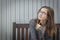 Young Daydreaming Female Student With Pencil Looking to the Side