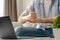 Young deaf man using laptop computer for online video conference call learning and communicating in sign language