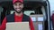 Young delivery man carrying cardboard box - People working with fast deliver