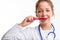 Young dental nurse or doctor brushing her teeth