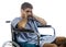 Young depressed and frustrated injured man in hospital patient gown desperate and upset at wheelchair after suffering accident or