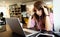 Young depressed tired woman working studying on notebook