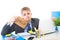 Young desperate businessman holding help sign looking worried suffering work stress at computer desk