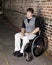 Young determined man in wheelchair