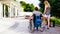 Young disable man walking in the park with his wife