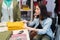 Young disabled woman browsing in clothing store