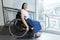 Young disabled woman in wheelchair near handicapped walkway transportation convenience for disabled people concept