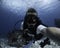 young dive instructor taking a selfie in the caribbean ocean