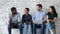 Young diverse candidates laughing, chatting, waiting for job interview