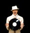 Young DJ in white costume holding vinyl record in