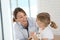 Young doctor examining little girl with stethoscope