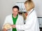 Young doctor in her office with skull