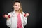 Young doctor portrait holding pair of dumbbells making exercise