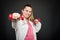 Young doctor portrait holding pair of dumbbells working out