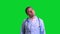 Young doctor stand and warming his neck and back on green chroma key background