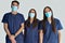 Young doctors dentists looking at the camera with white background