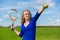 Young dutch woman holding tennis racket and ball outdoors