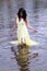 Young East Indian Woman Standing In River